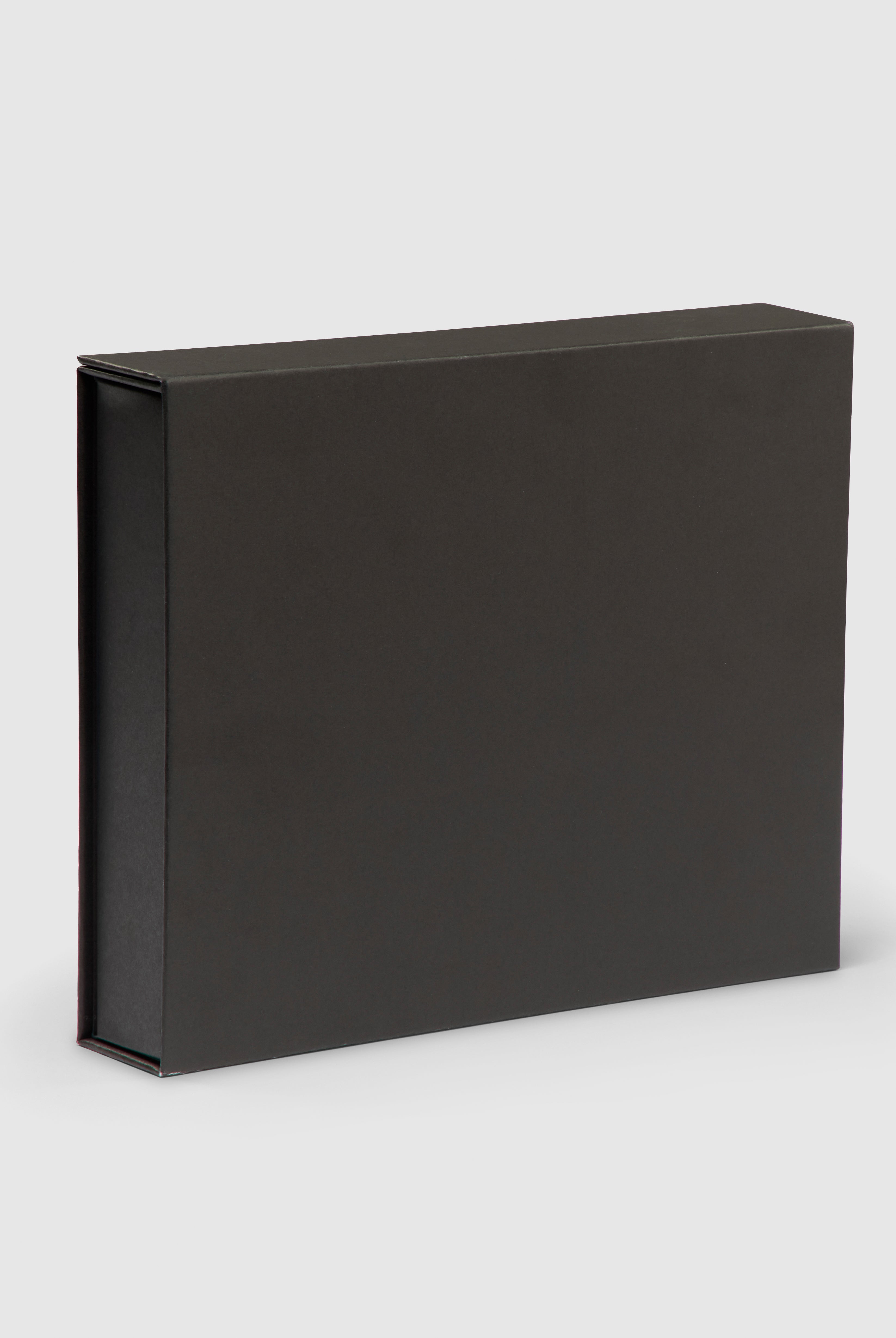 Black gift box with turquoise interior and magnetic closure.