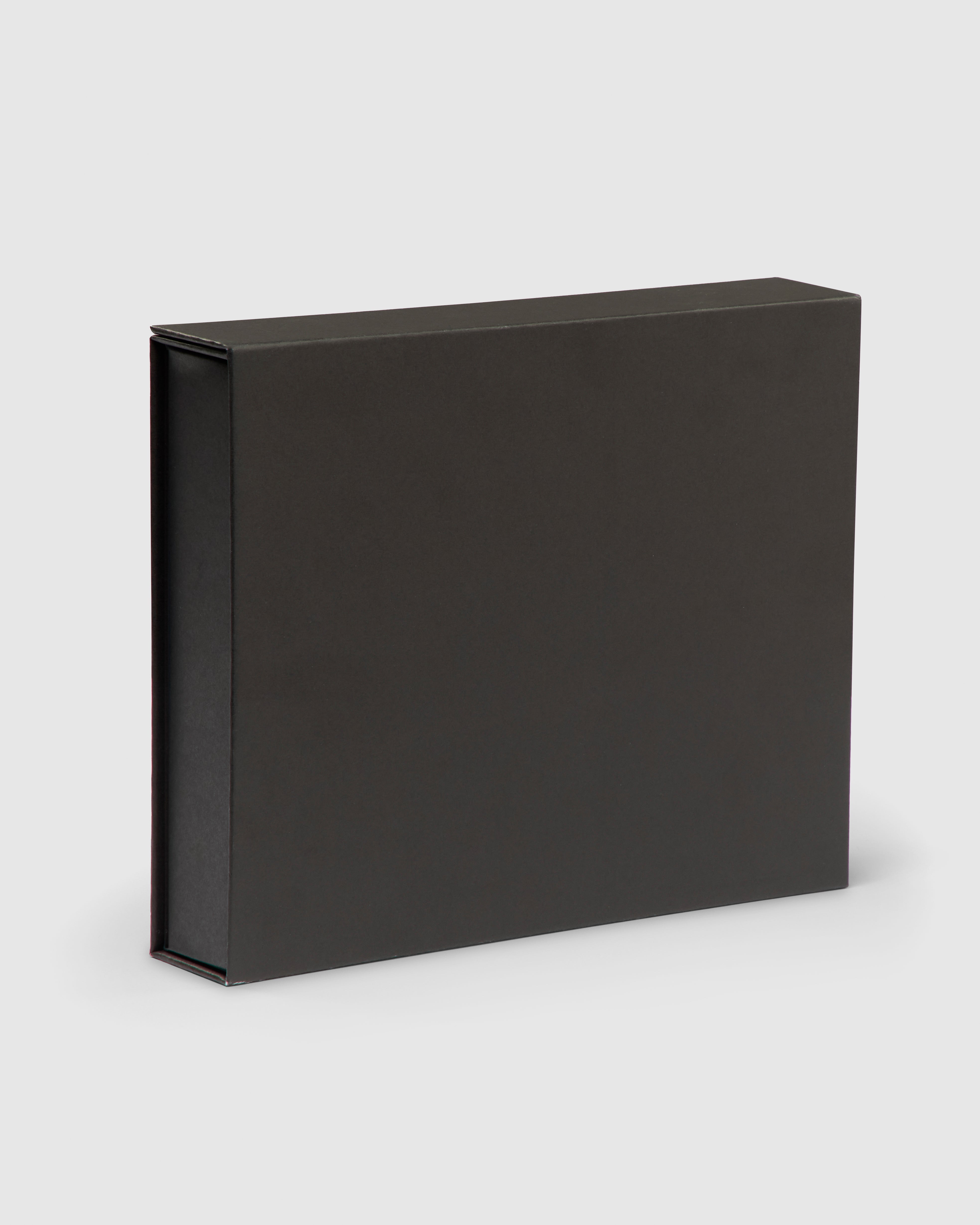 Black gift box with turquoise interior and magnetic closure.