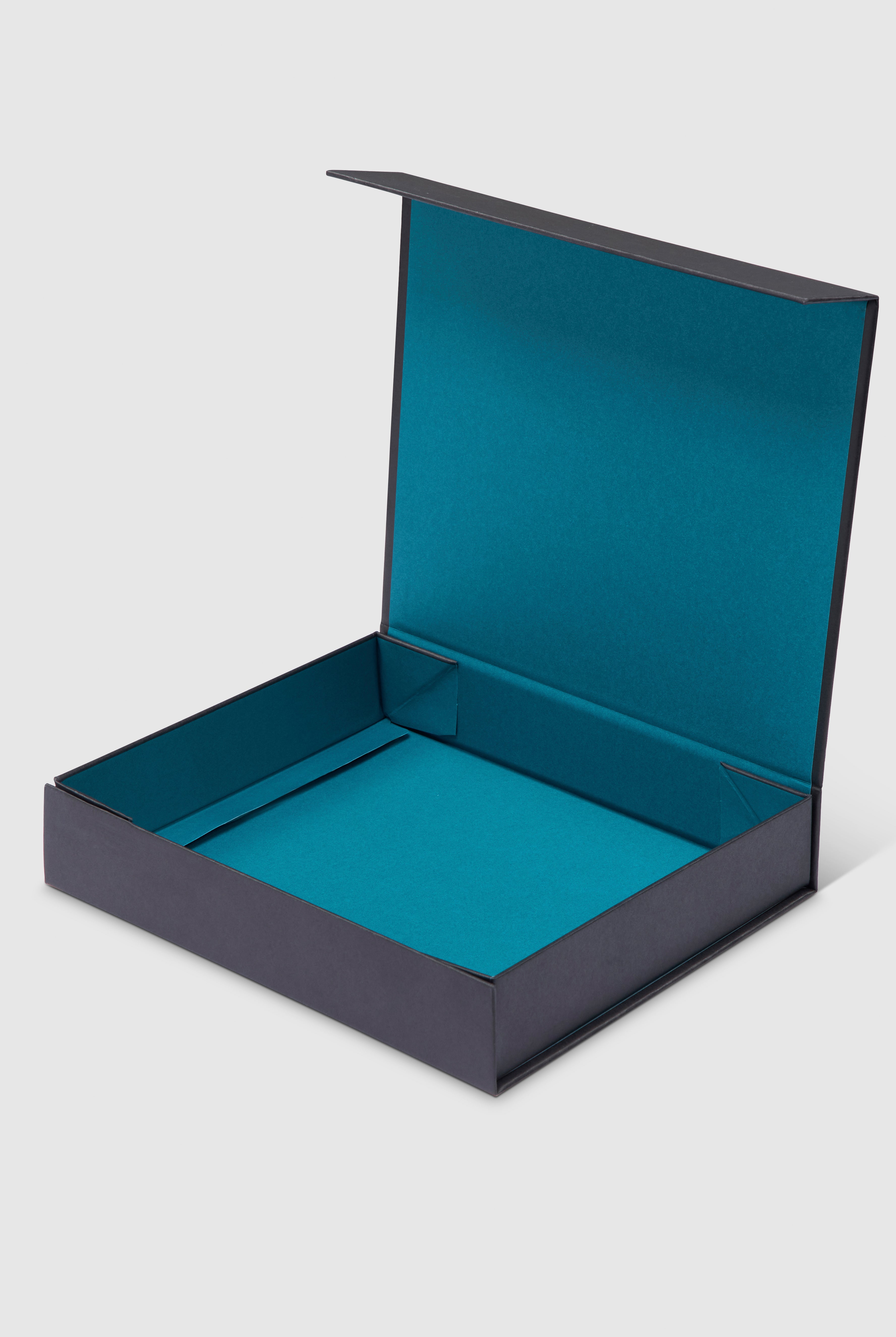 Black gift box with turquoise interior and magnetic closure.