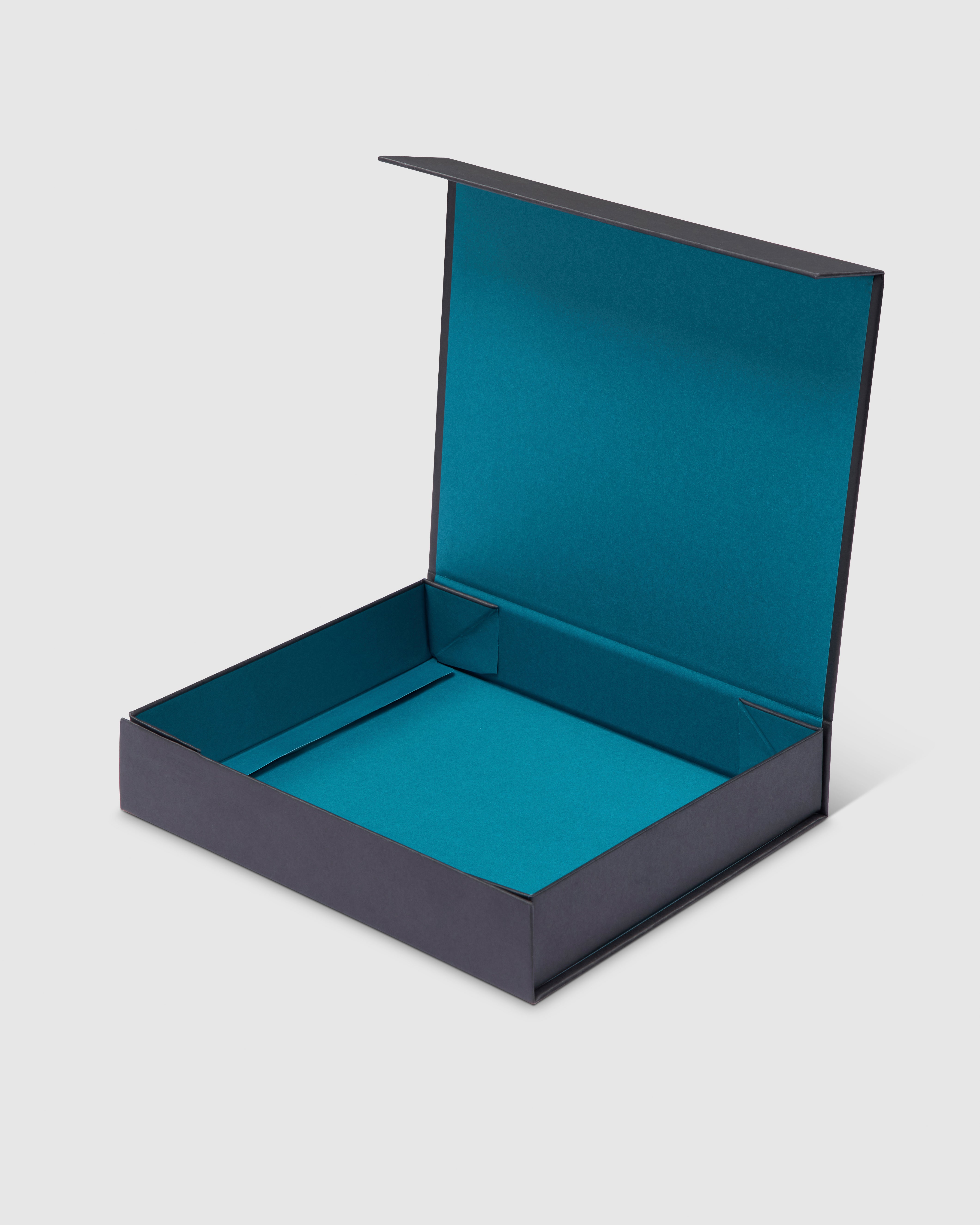 Black gift box with turquoise interior and magnetic closure.