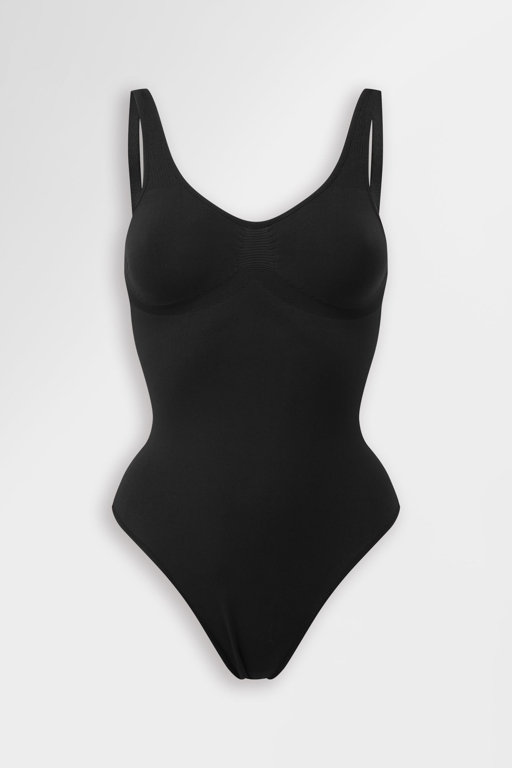 Black seamless thong body with compression and bust support.