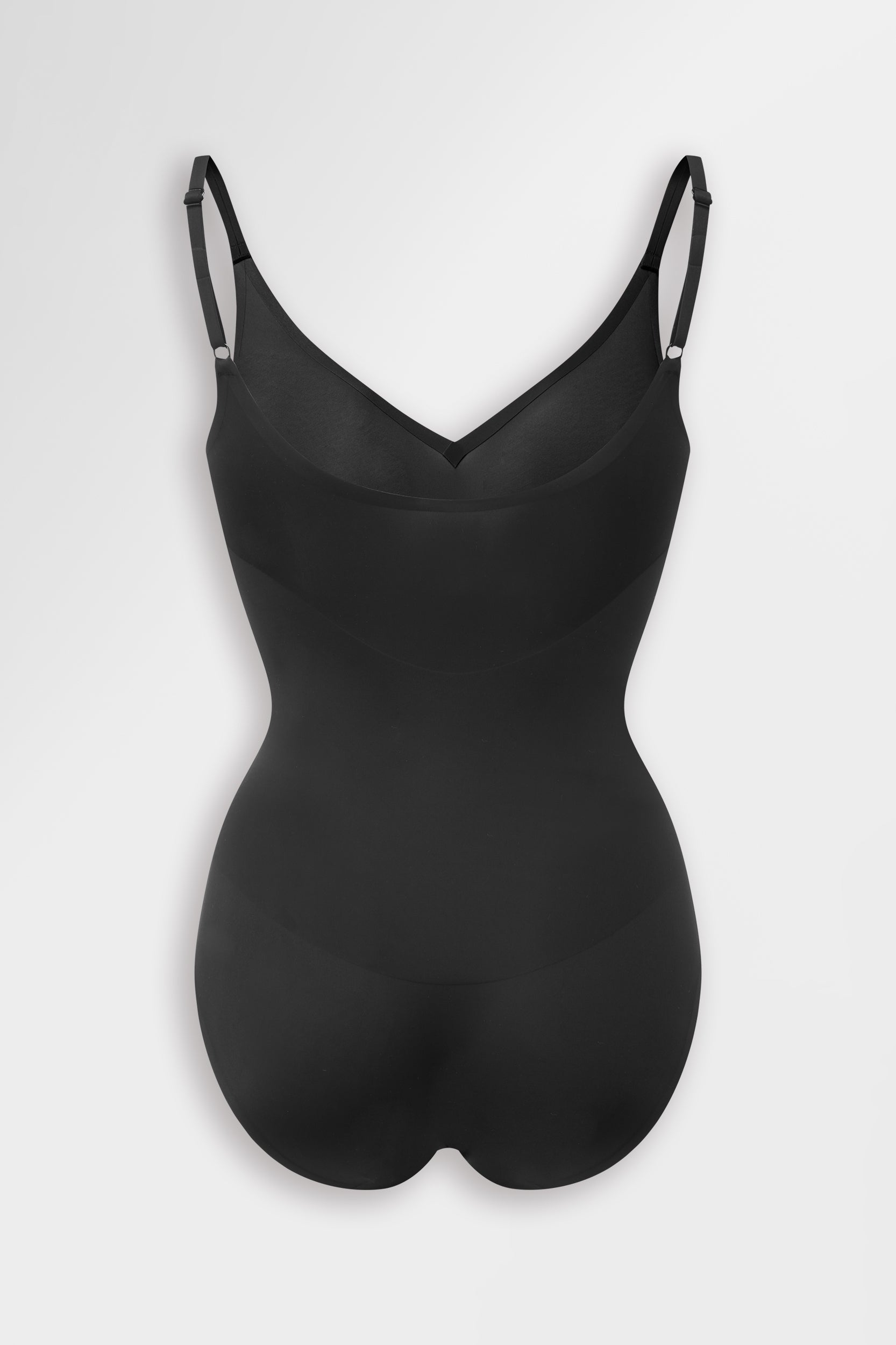 Black shaping bodysuit, smooths, sculpts, supports, perforated.