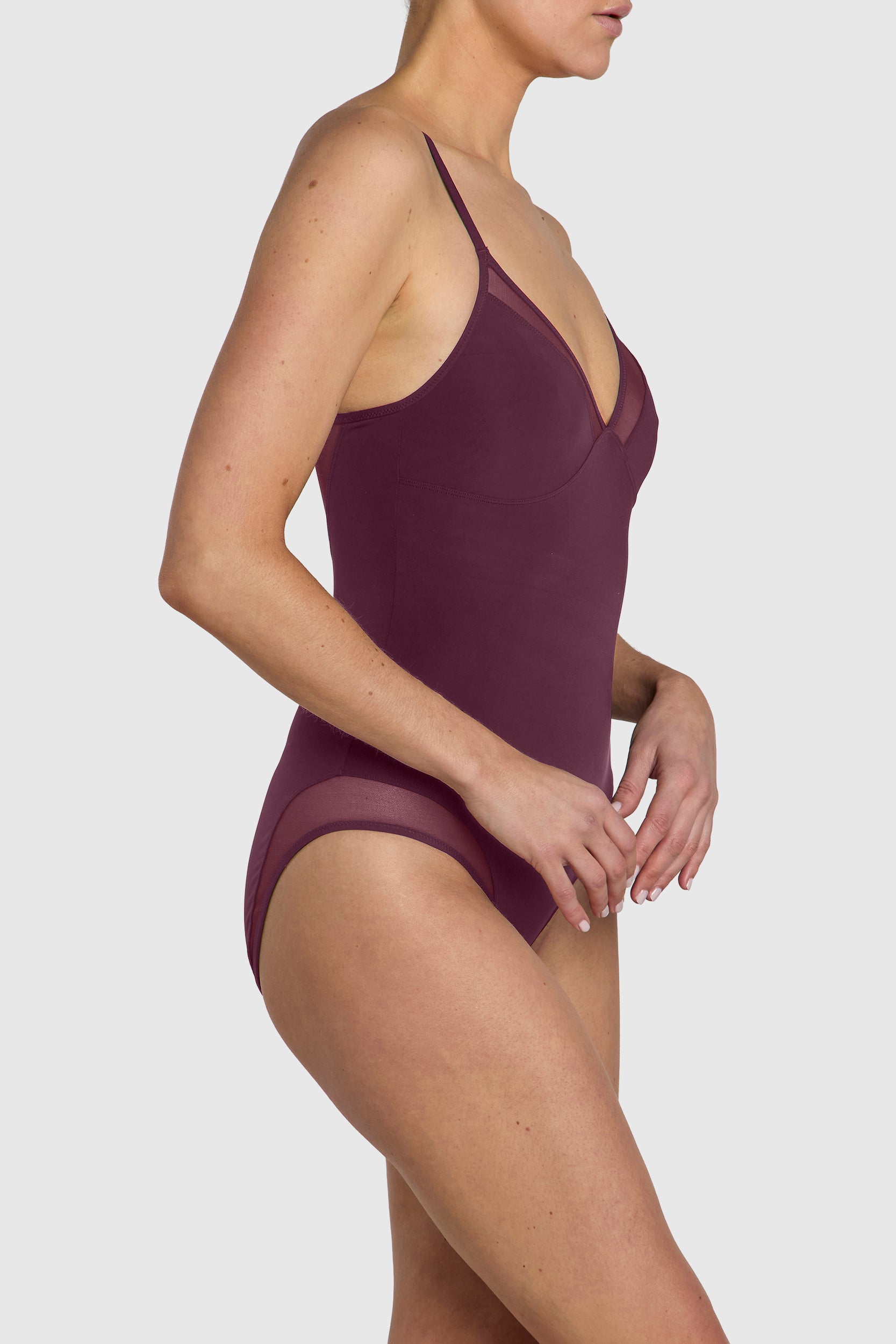 Silky sleek bodysuit with mesh paneling