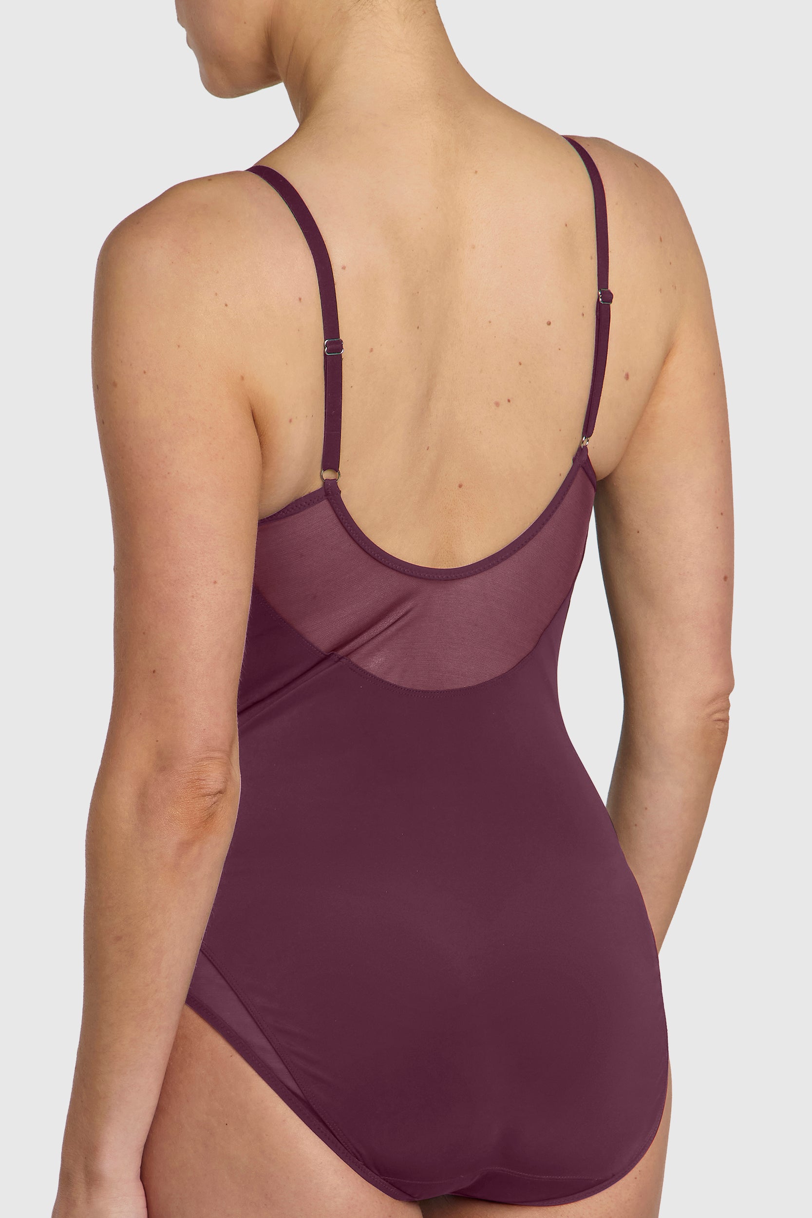 Silky sleek bodysuit with mesh paneling