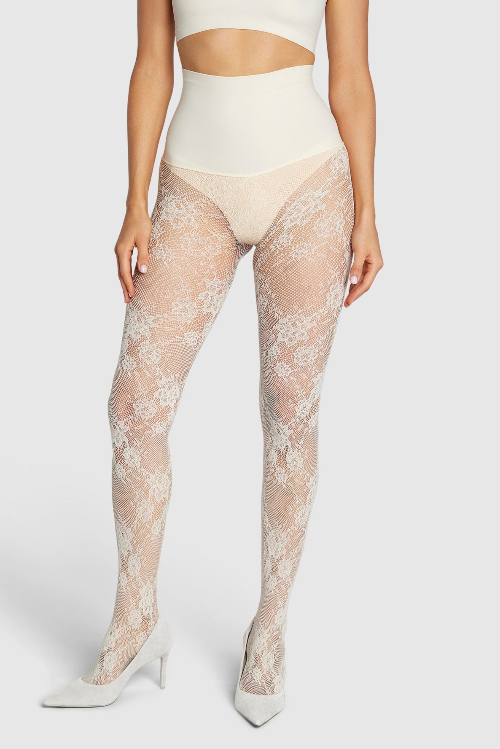 Floral lace tights with adaptive waistband and reinforced toe.