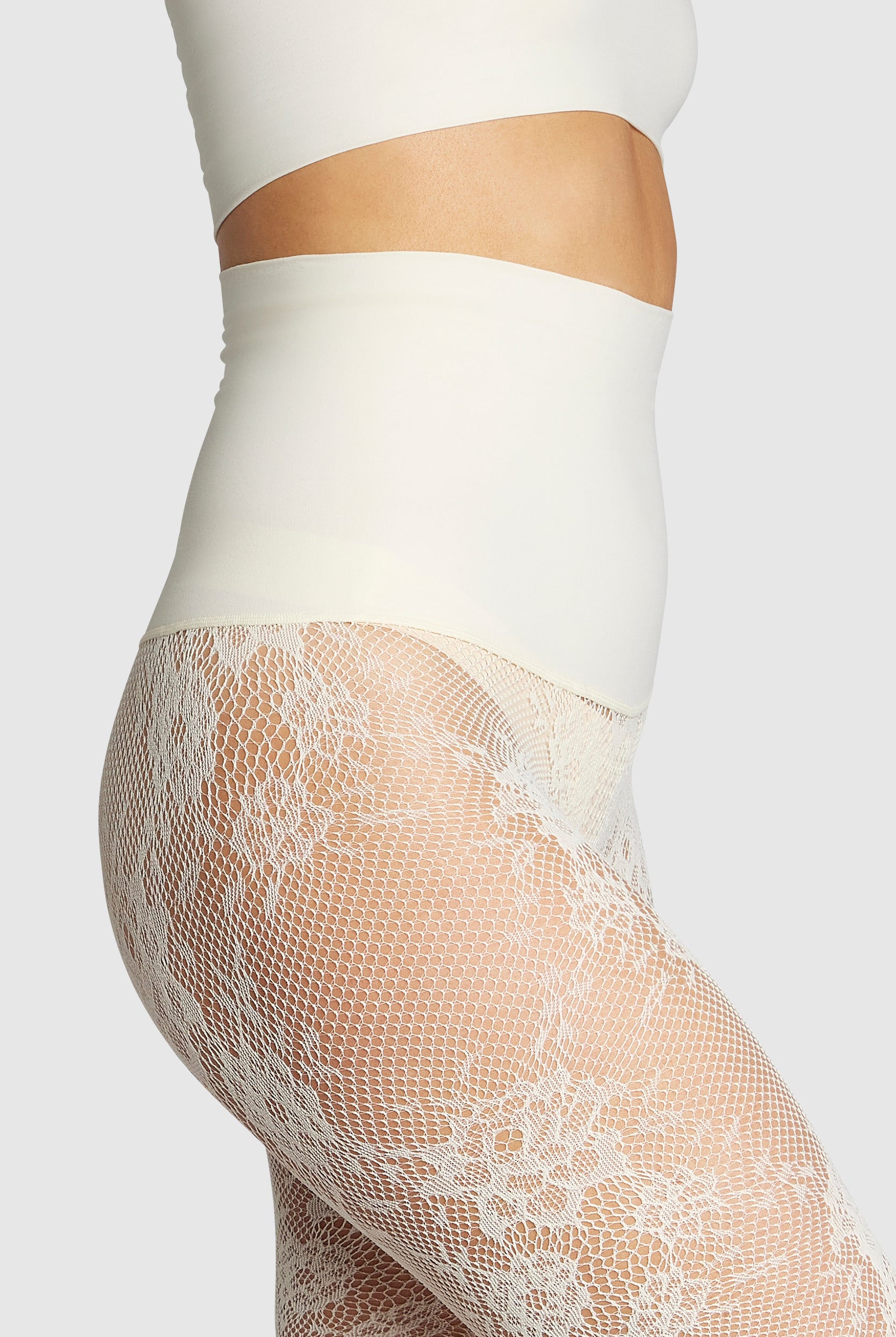 Floral lace tights with adaptive waistband and reinforced toe.