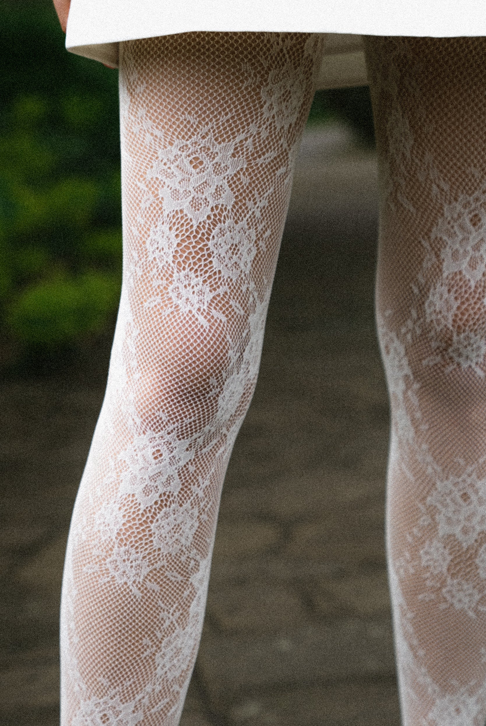 Floral lace tights with adaptive waistband and reinforced toe.