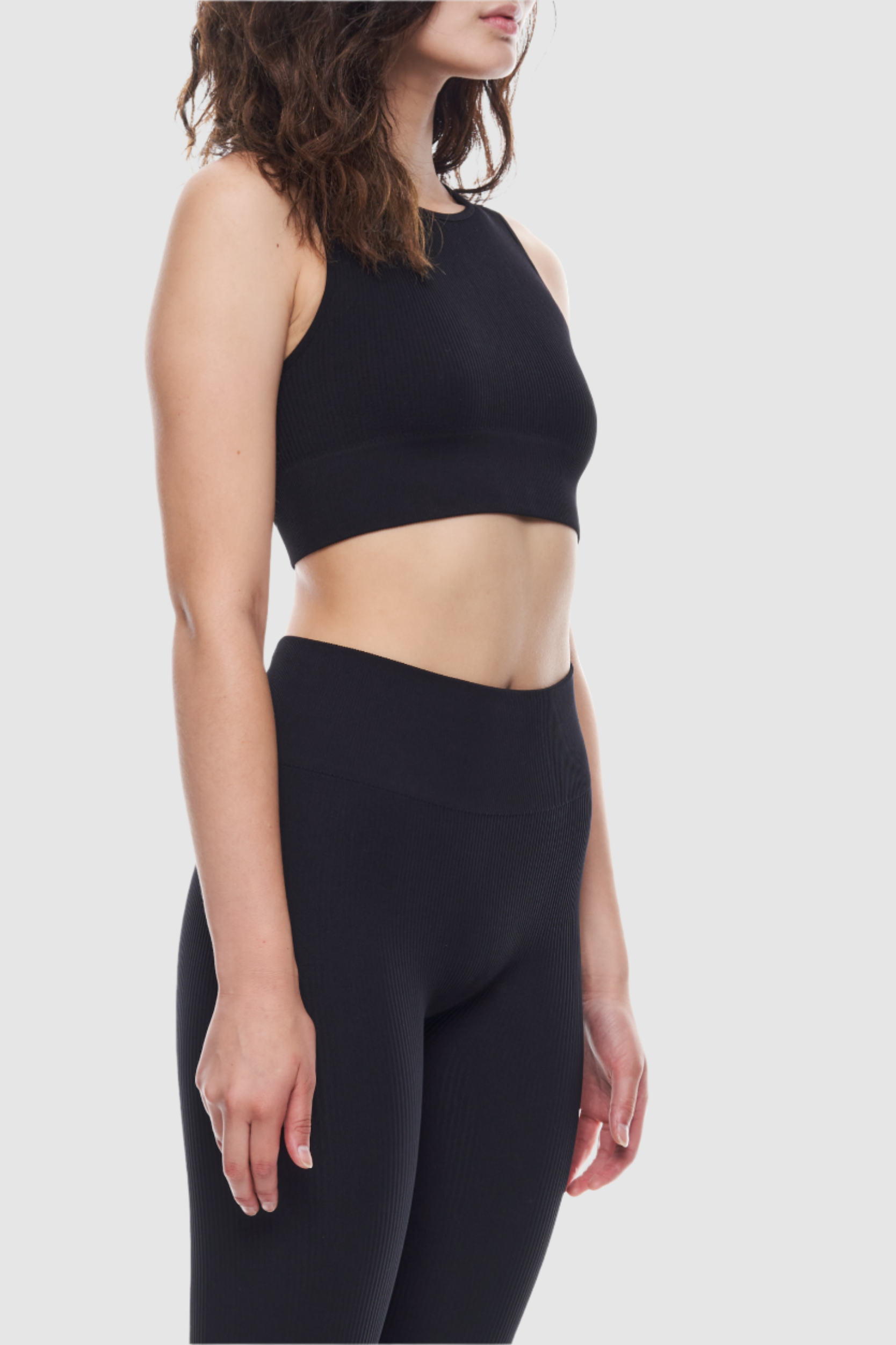 Sleeveless ribbed crop top made from recycled materials.