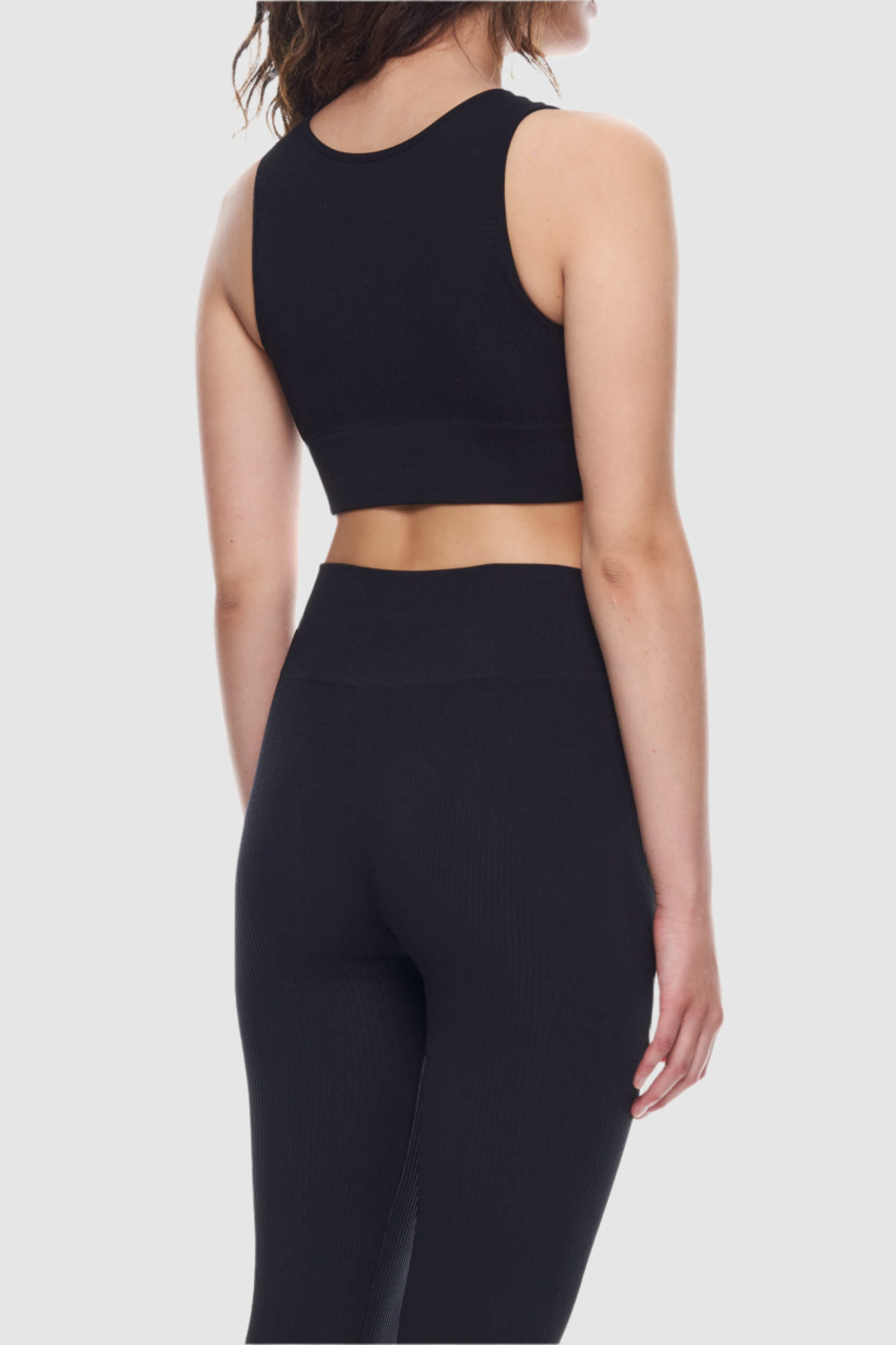 Sleeveless ribbed crop top made from recycled materials.