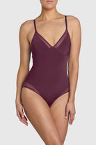 Silky sleek bodysuit with mesh paneling