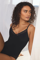 Silky sleek bodysuit with mesh paneling
