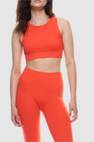 Sleeveless ribbed crop top made from recycled materials.