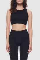 Sleeveless ribbed crop top made from recycled materials.